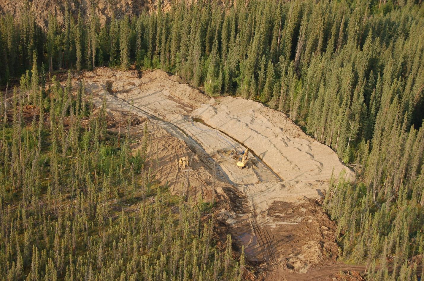 Placer excavation following buried channel geometry